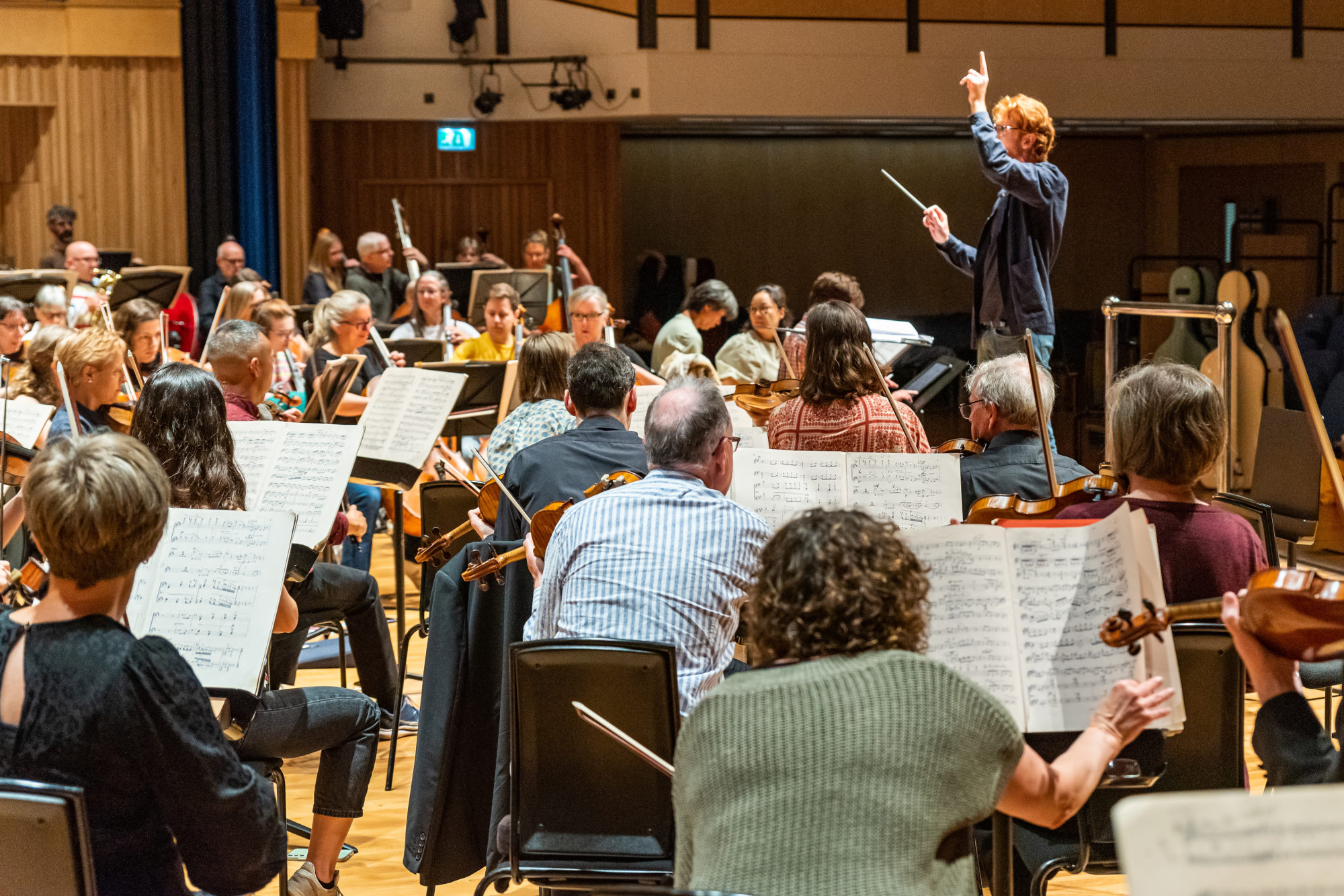 Harry Sever conducting the orchestra during rehearsal at Saffron hall